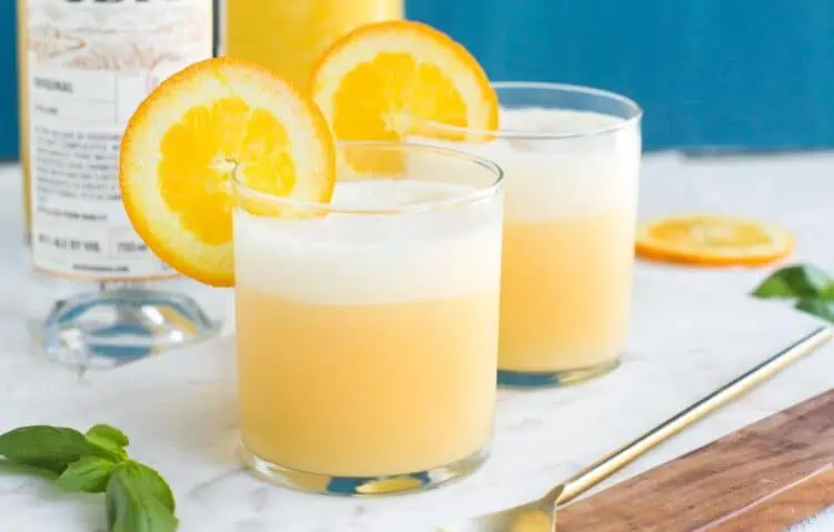 Dairy Free Orange Creamsicle Cocktails with Coconut Milk Garnished with an Orange Slice