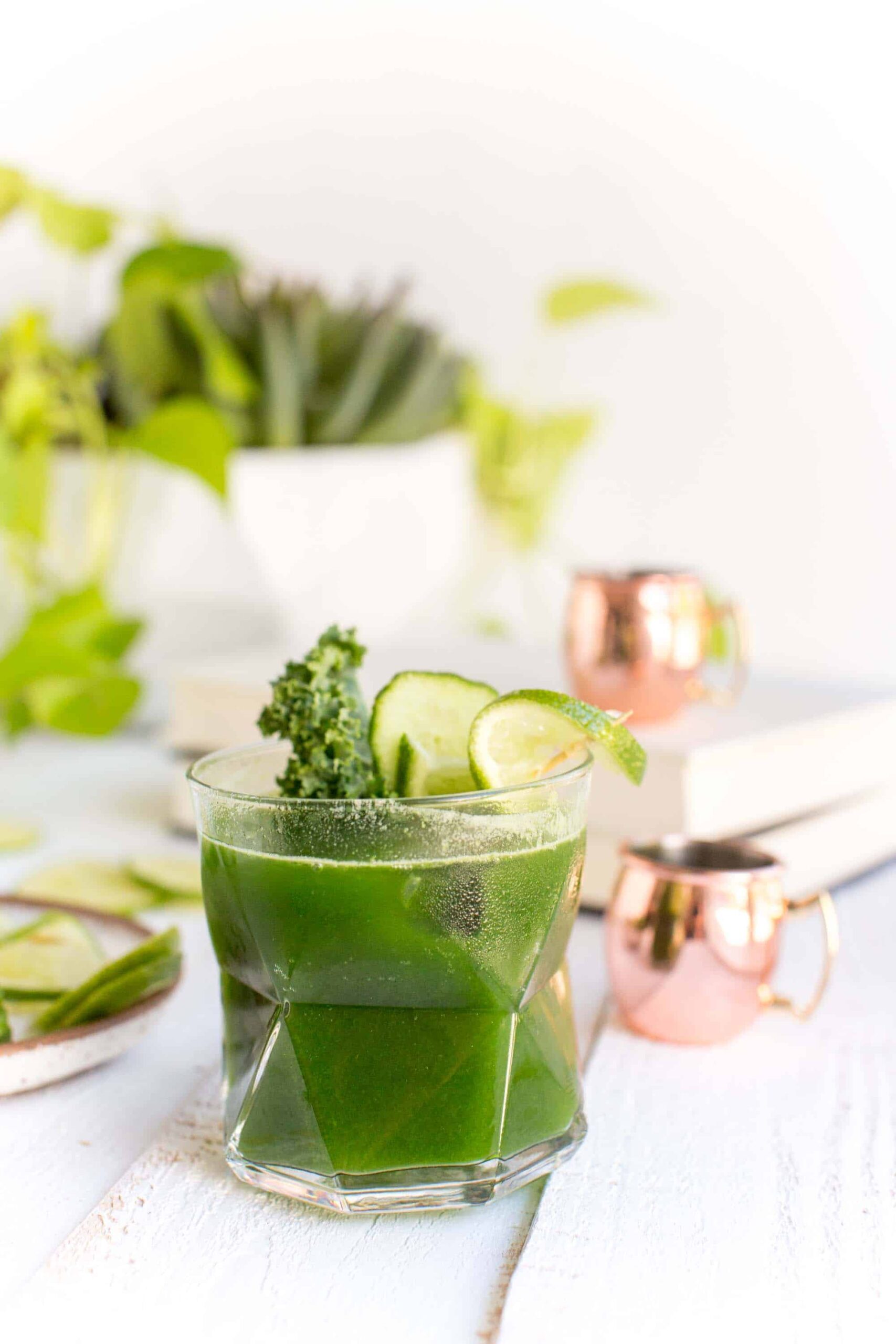 Vegan Moscow mule made with green kale juice in a glass.