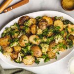 Vegan Cheesy Potatoes With Garlic and Broccoli on a Serving Platter