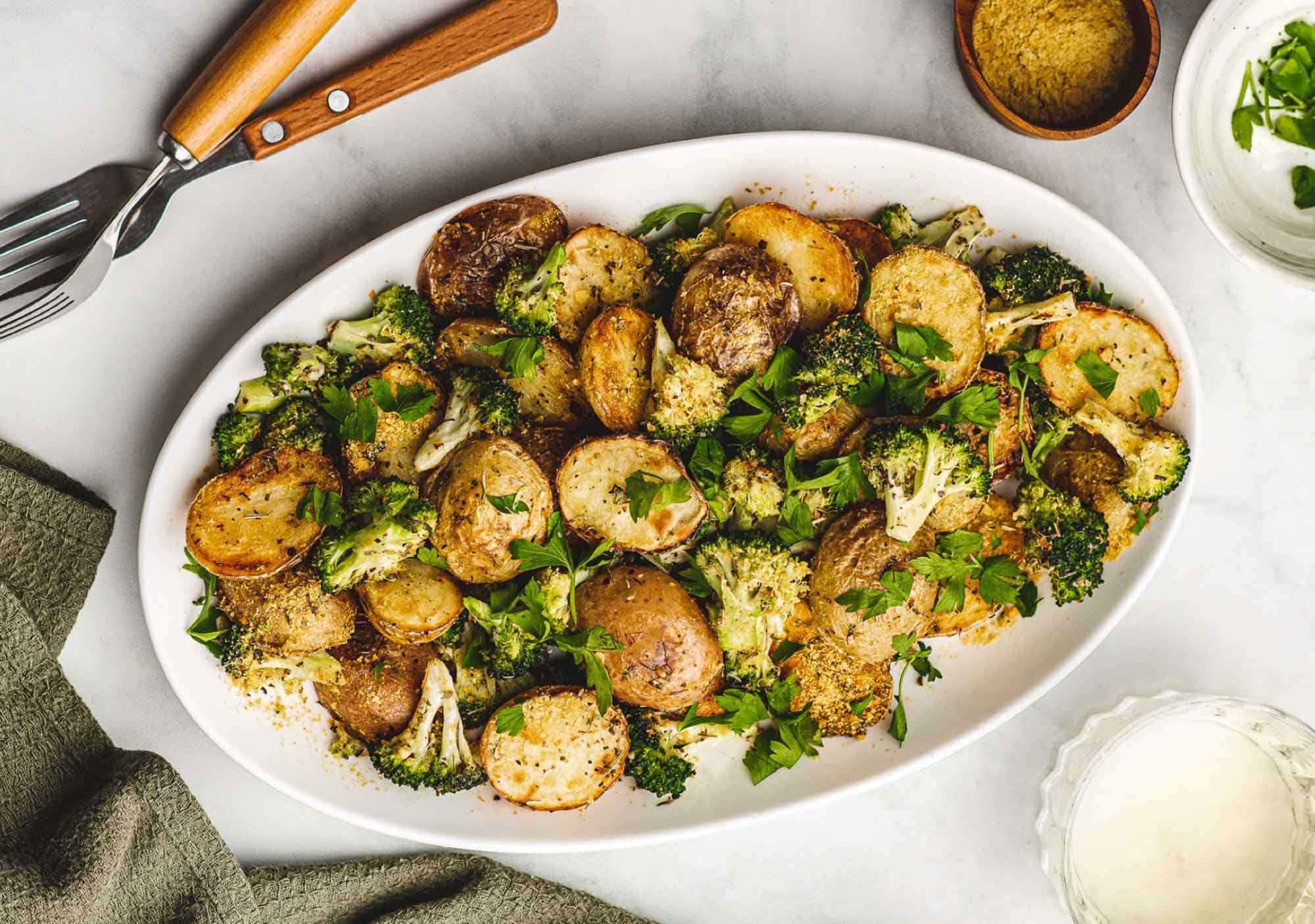 Vegan Cheesy Potatoes With Garlic and Broccoli on a Serving Platter