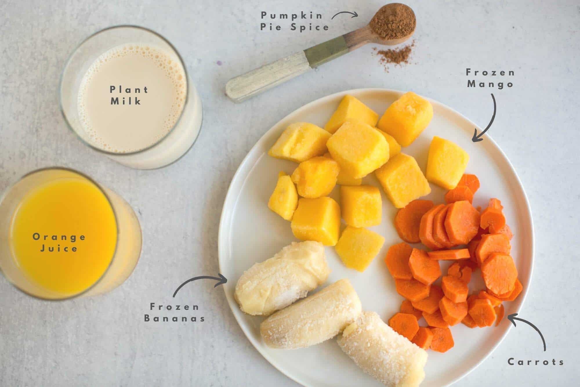 Halloween Smoothie Ingredients Flatlay Carrots Banana Mango Milk Orange Juice