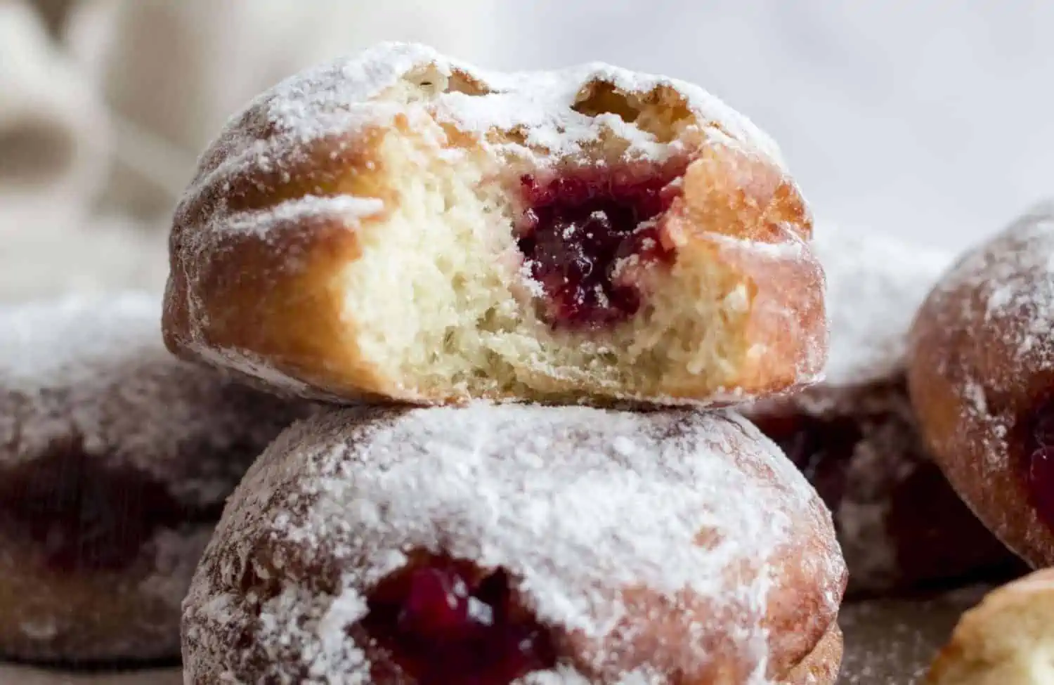 Vegan Sufganiyot donuts stacked on top of each other