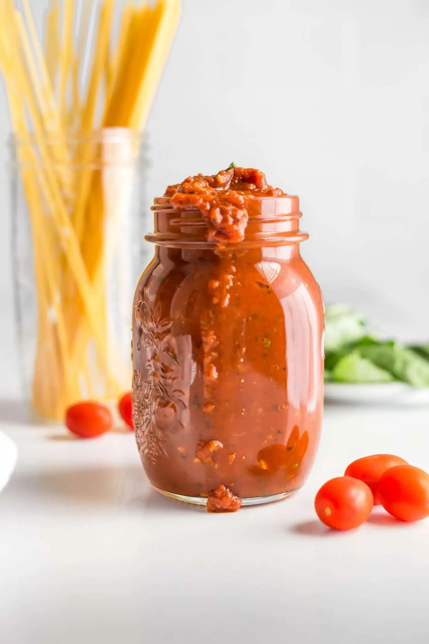 A jar of homemade tomato marinara sauce. 