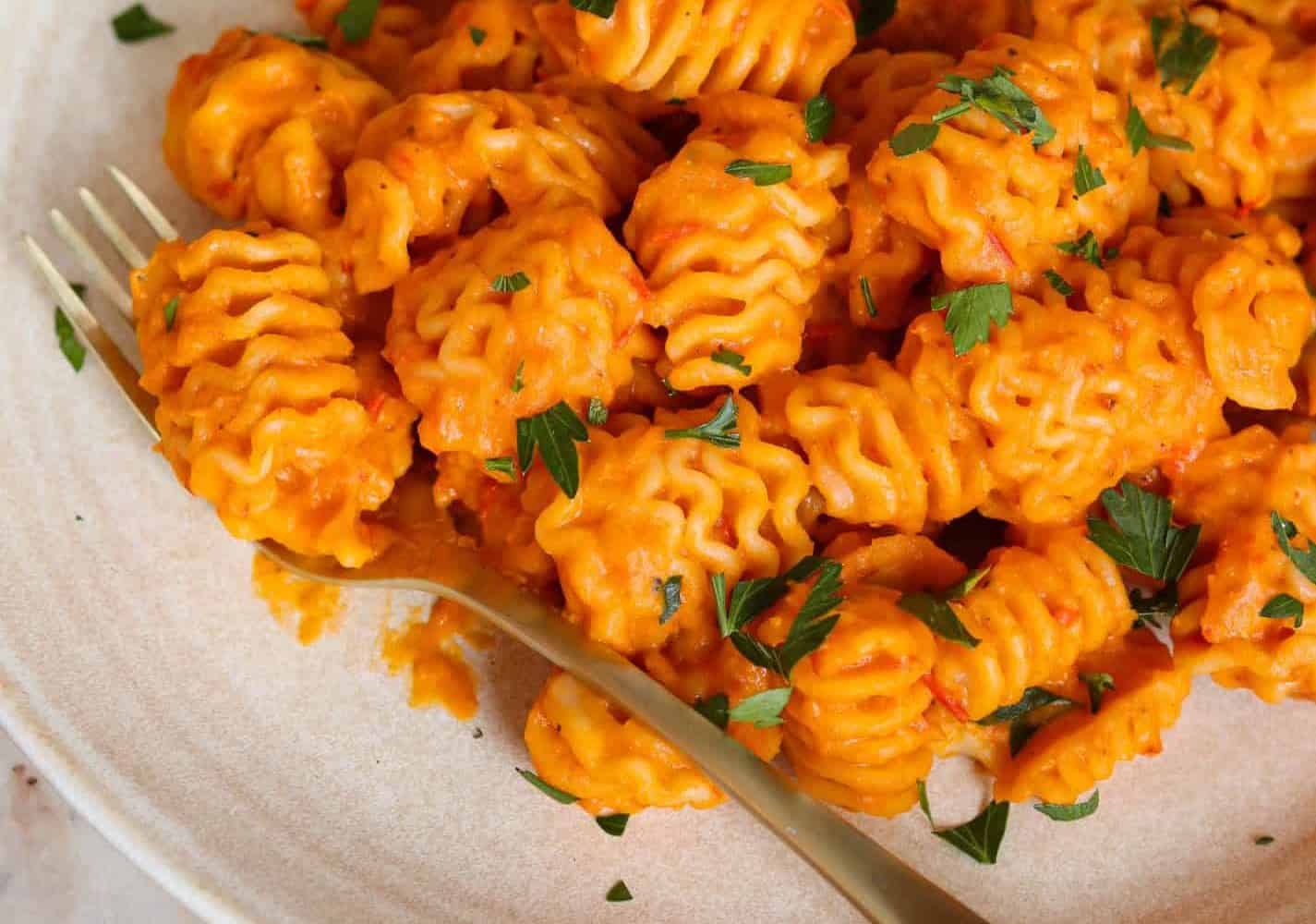 Vegan Pumpkin Pasta on a plate with a fork.