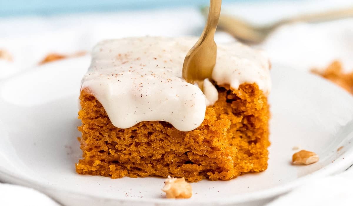 A serving of Vegan Pumpkin Sheet Cake by Jessica in the Kitchen with a fork.