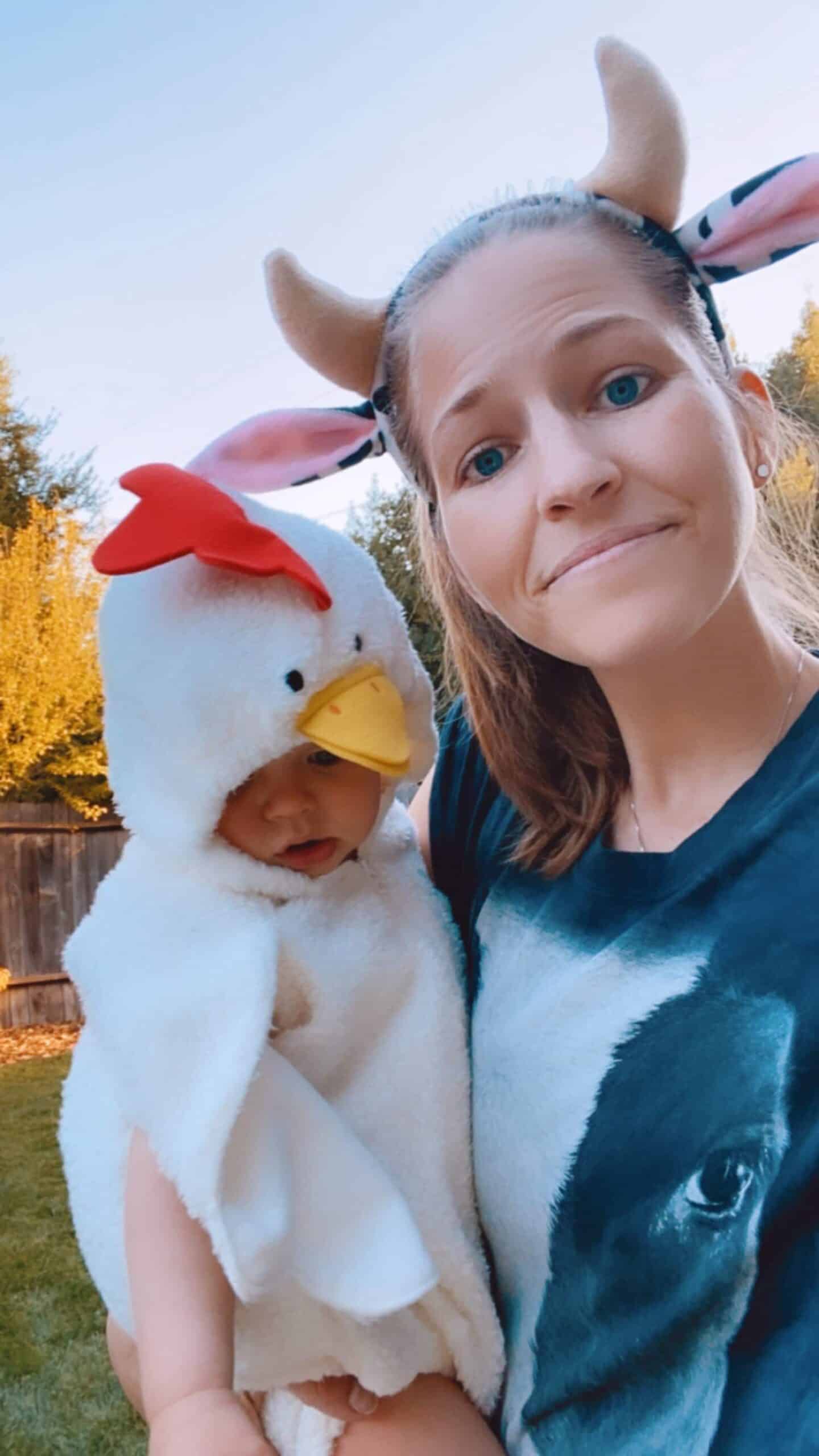 Vegan mom and baby wearing matching halloween costume cow and chicken