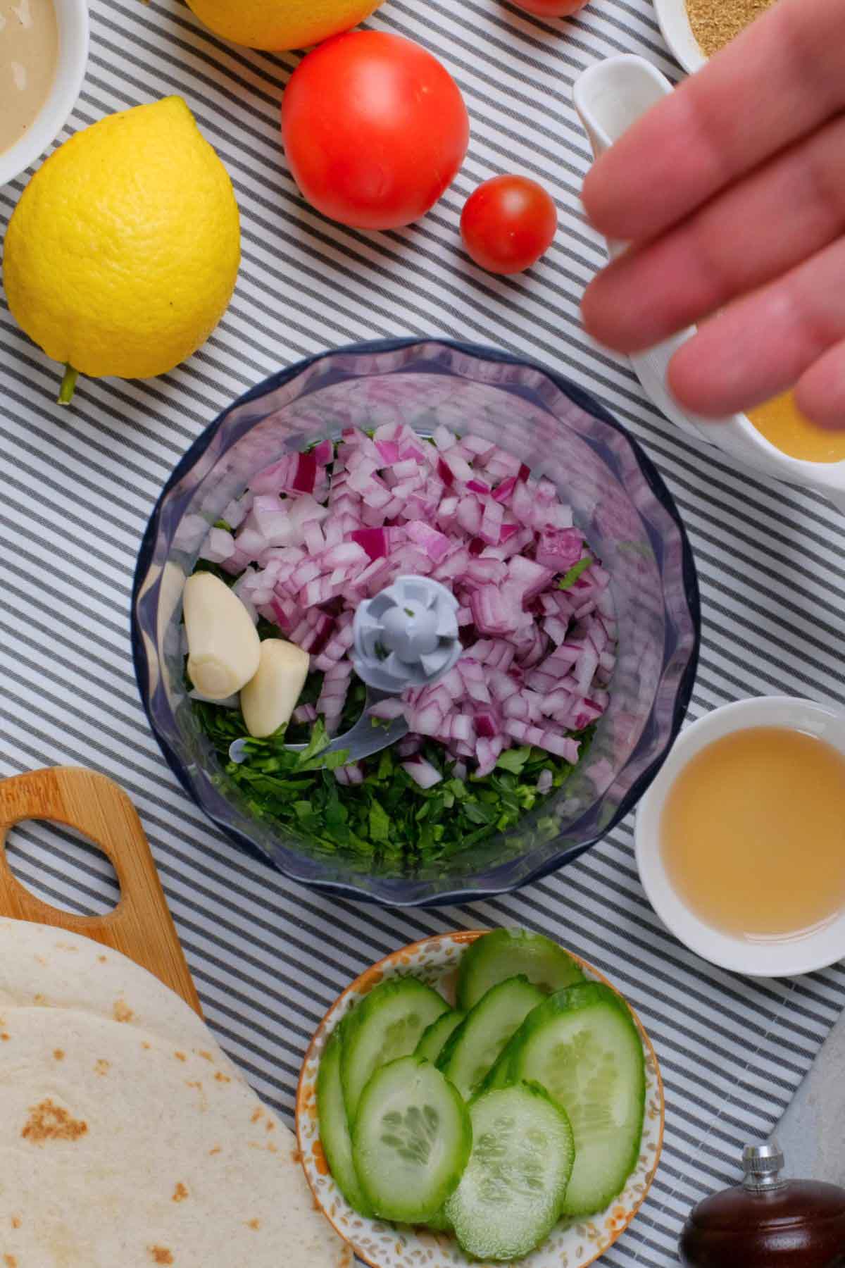 Onions, garlic, and parsley in a food processor.
