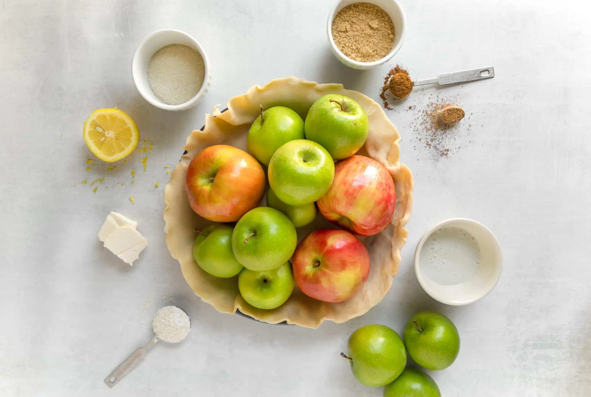 Vegan Apple Pie Ingredients Flatlay Photo Apples in Pie Baking Dish Tin