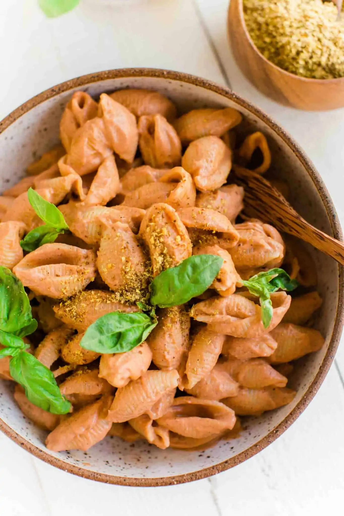 Easy Pink Sauce Pasta With Fire Roasted Tomatoes in a bowl topped with fresh basil.