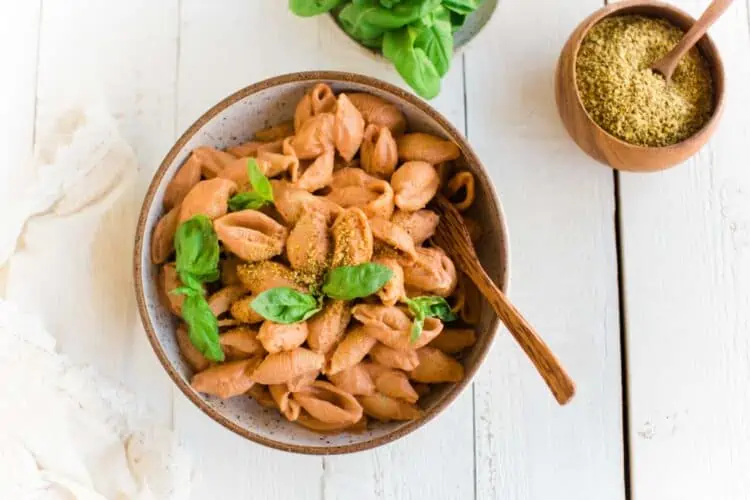 Easy Pink Sauce Pasta In A Rustic Pottery Bowl With Basil and Vegan Parmesan
