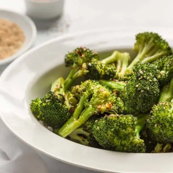 Air fried broccoli with toasted sesame oil In a serving platter with sesame seeds