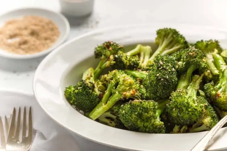 Air fried broccoli with toasted sesame oil In a serving platter with sesame seeds