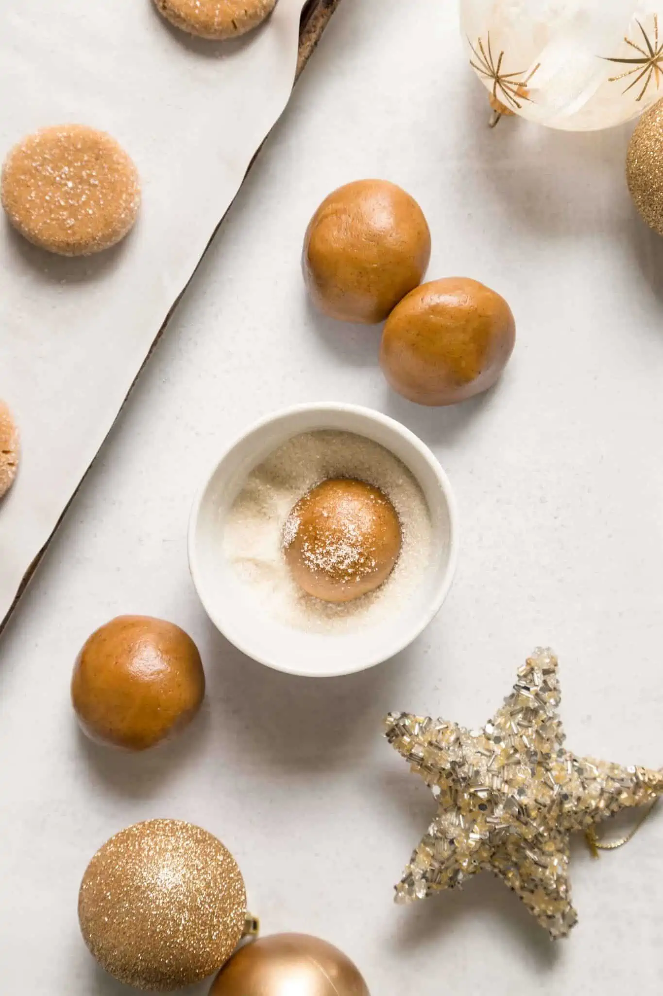 Vegan Gingersnap Cookies Dough Balls Flatlay With Christmas Holiday Ornaments and Sugar for Dipping