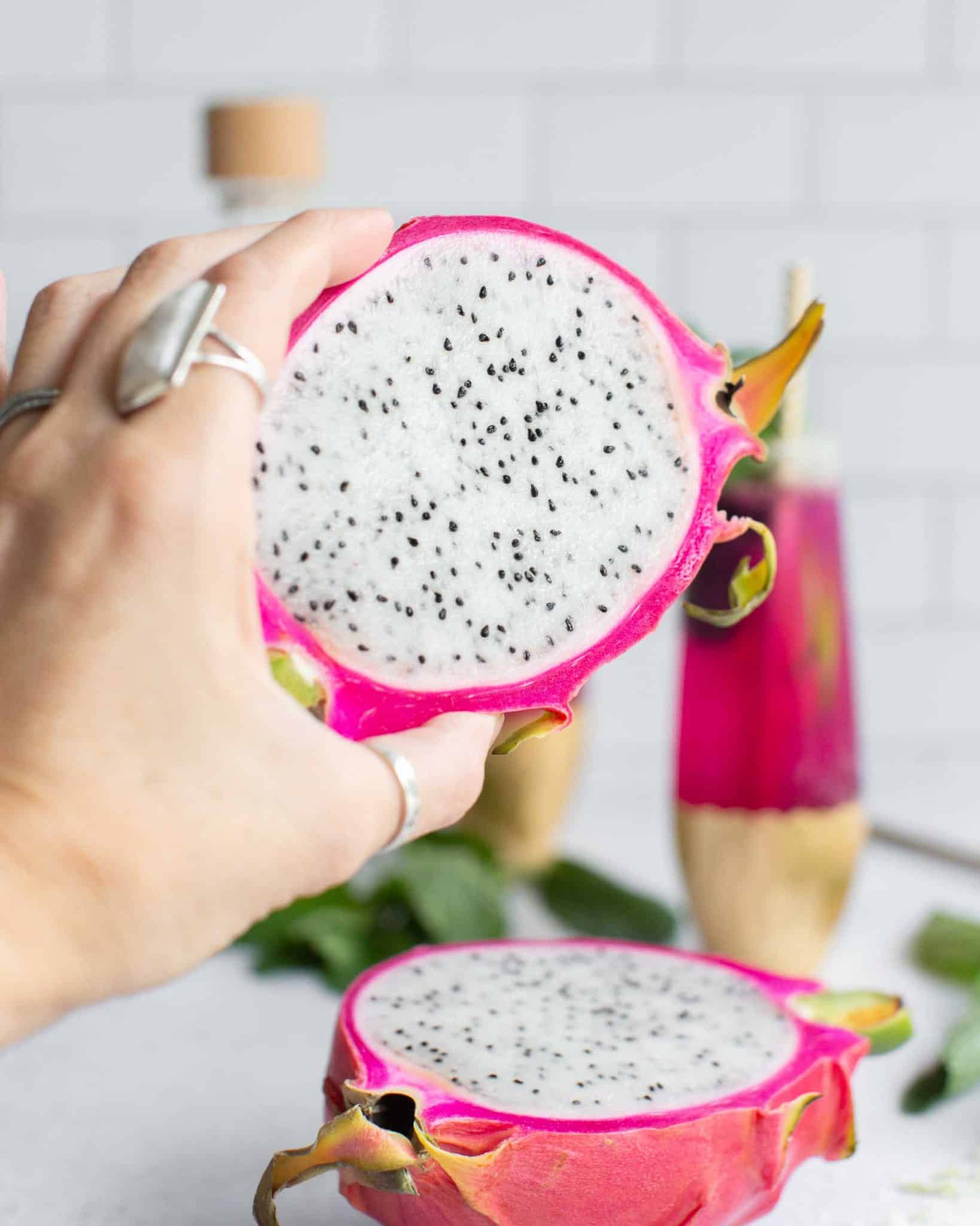 Holding Out a Sliced in Half White Dragonfruit