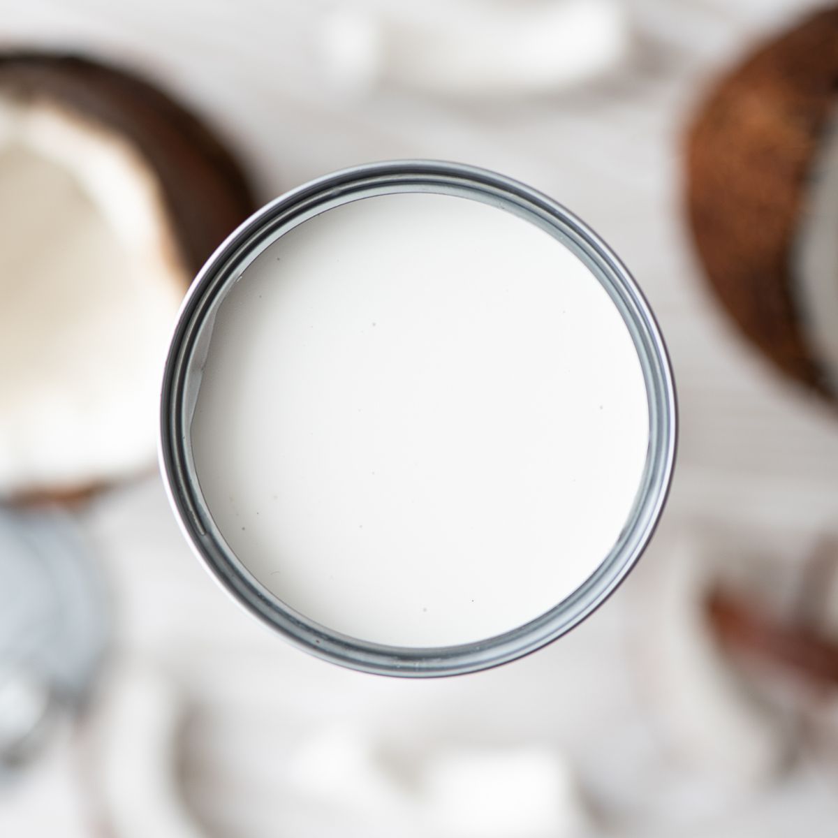A top-down shot of canned coconut milk.