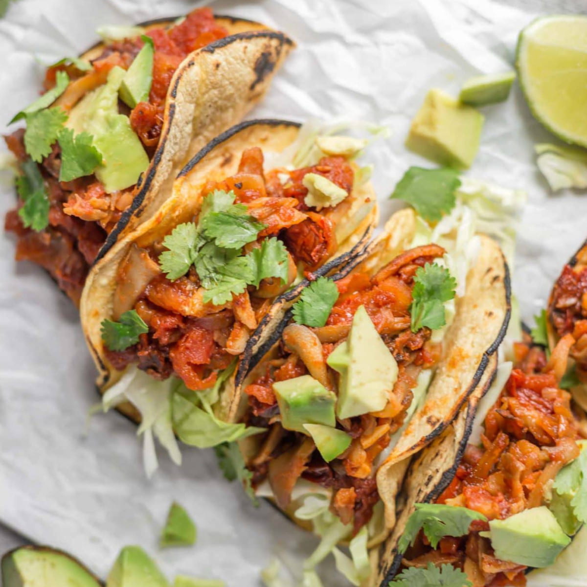 Oyster mushroom tacos with chipotle seasoning with lime, avocado, and cilantro.