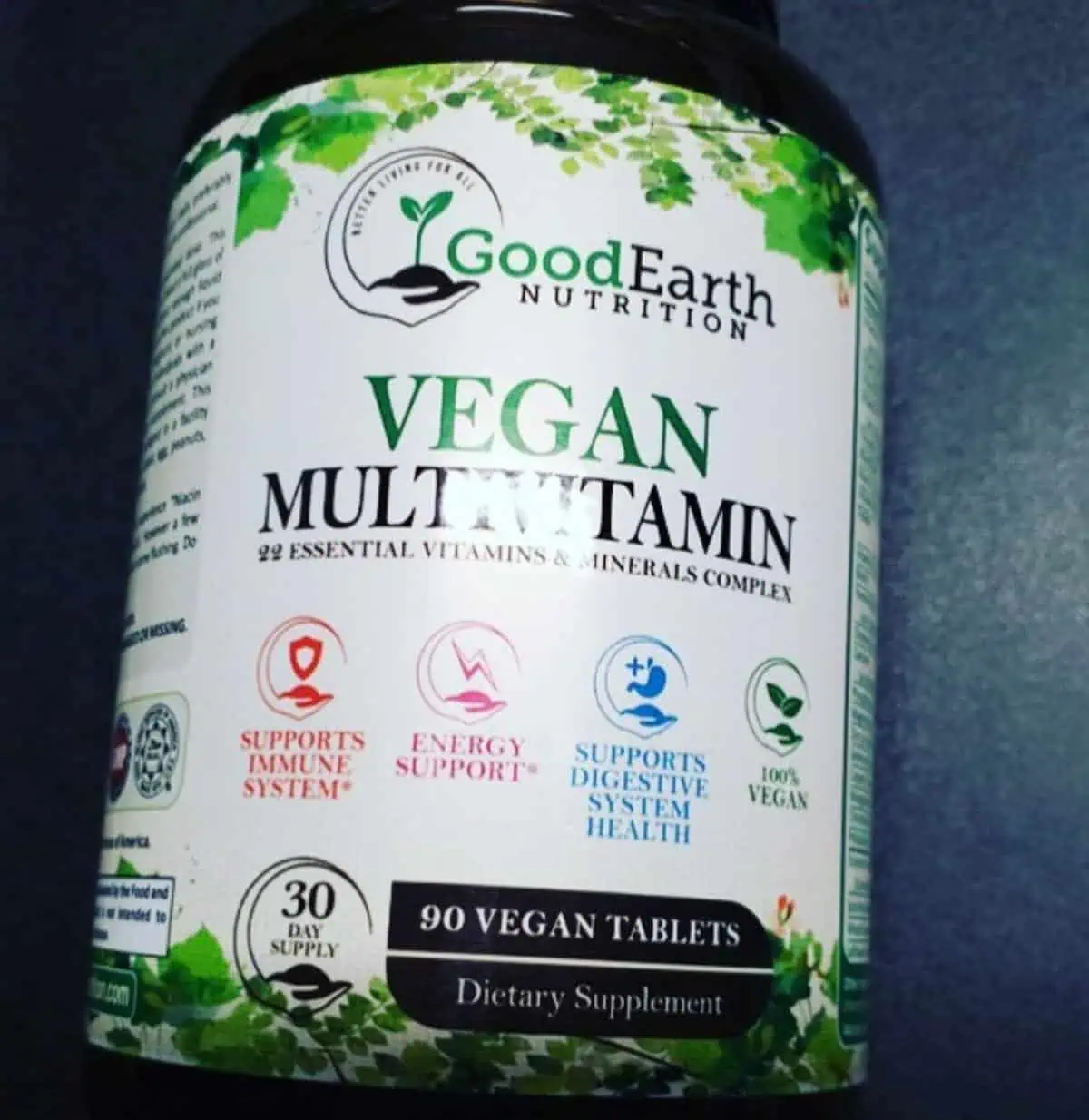 A bottle of Good Earth nutrition brand vegan multivitamins.