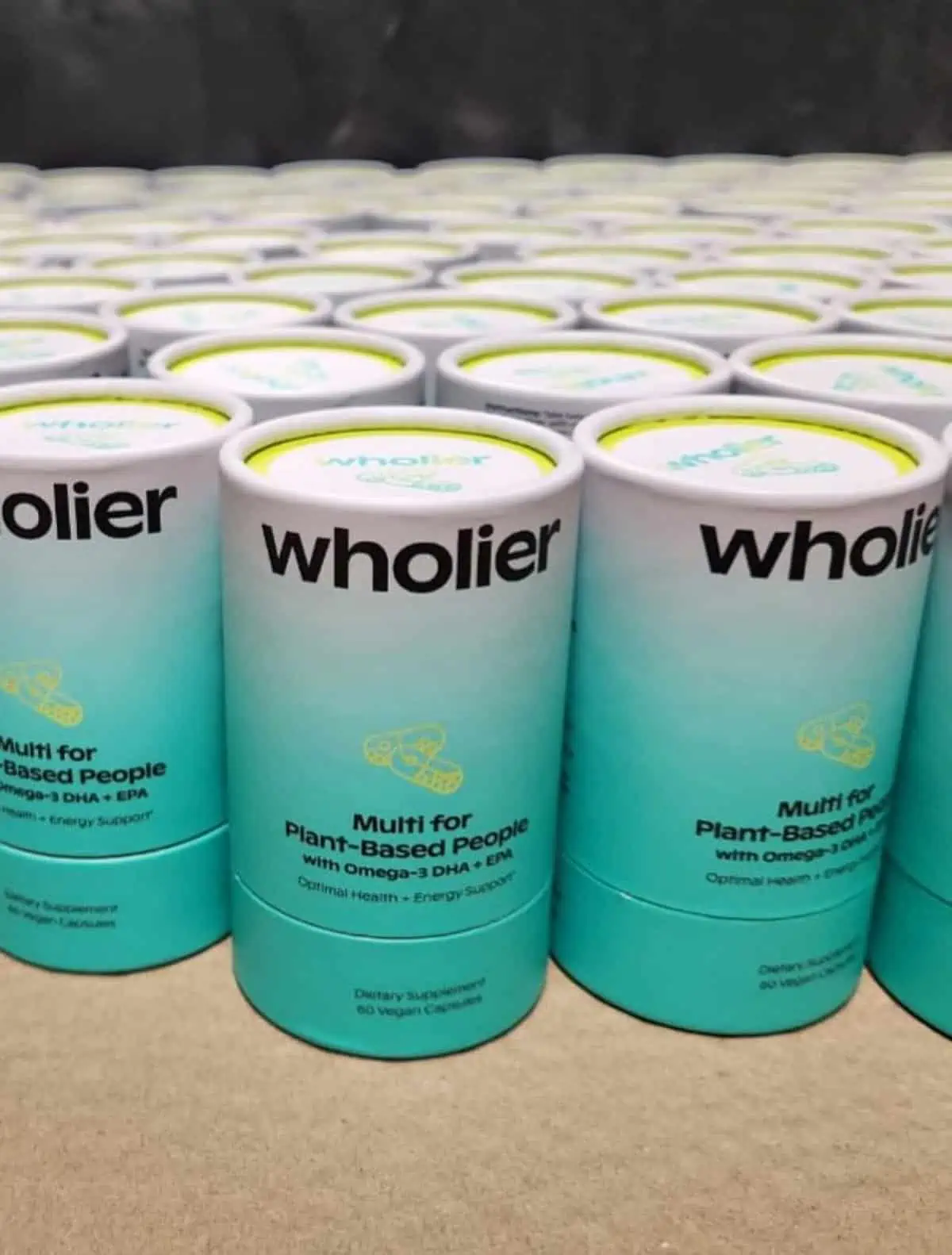 Containers of Wholier brand vegan multivitamins.