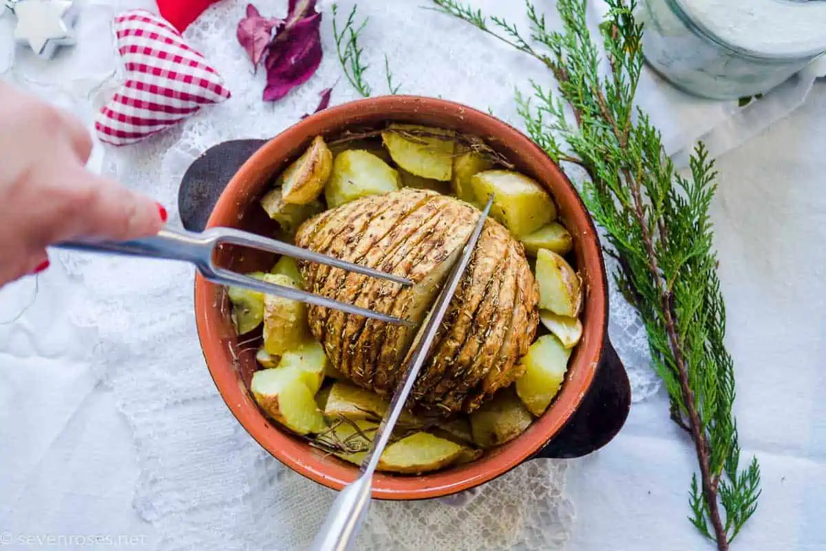 celery root roast in a pot with roasted potatoes