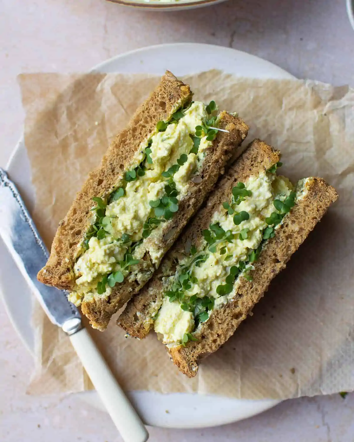 vegan egg sandwich on parchment paper