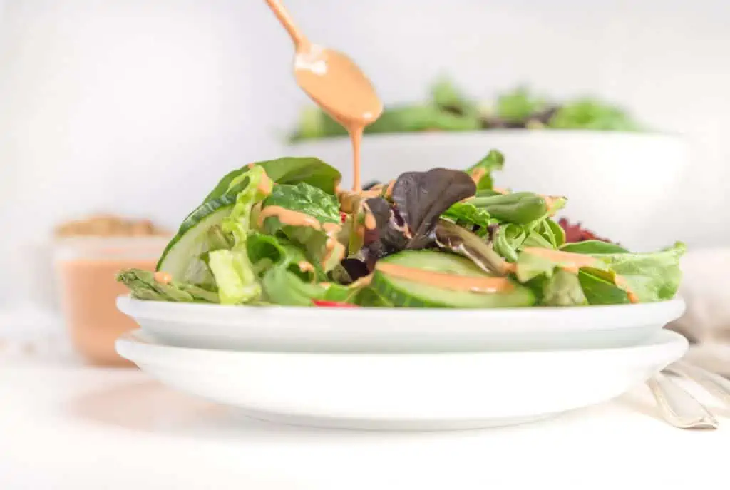 vegan salad with pink oil free french dressing