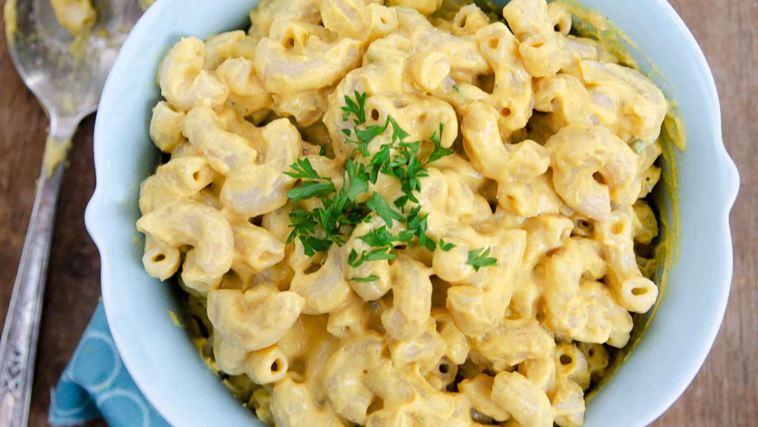 vegan mac and cheese in a bowl with parsley garnish