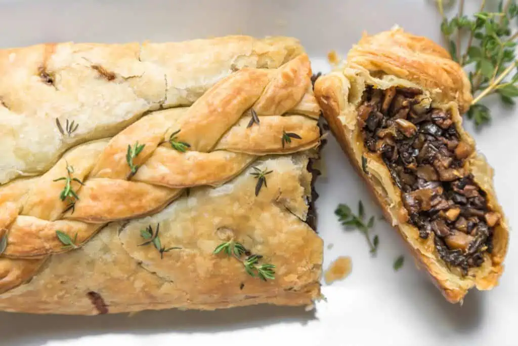 braided puff pastry vegan nut-free wellington garnished with thyme