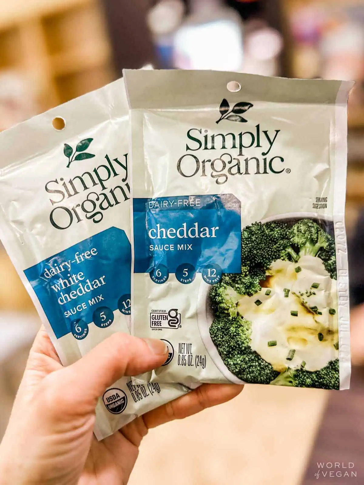 A packet of dairy-free cheddar sauce mix by Simply Organic.