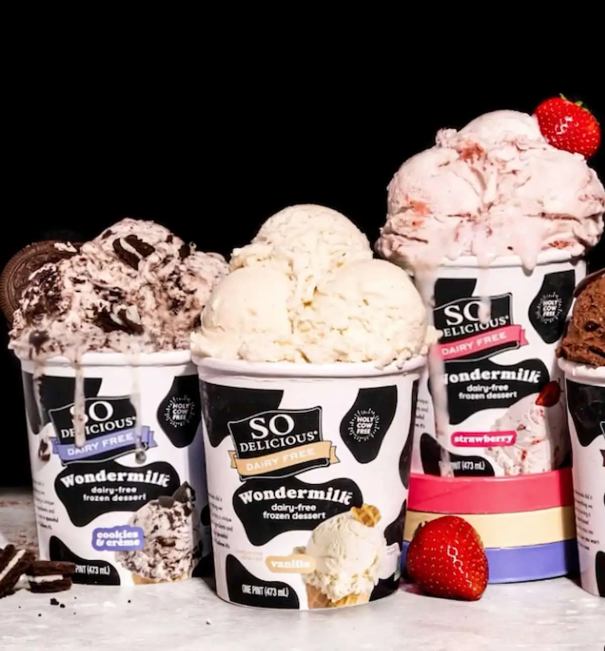 Four pint of So Delicious Wondermilk dairy-free ice cream with scoops dripping over the sides.