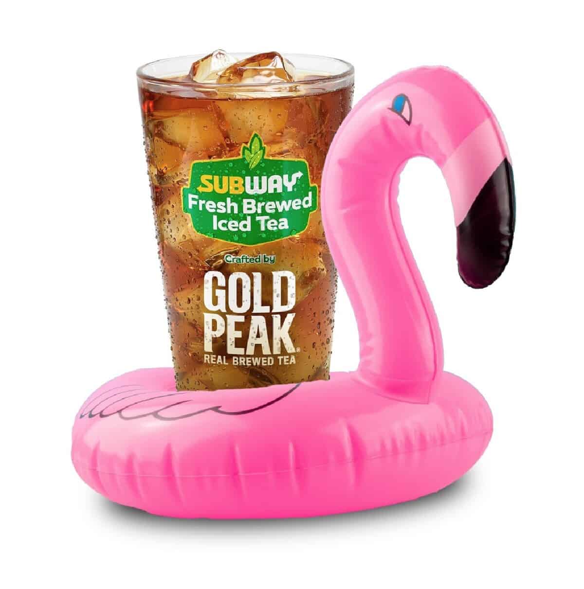 A large glass of Subway fresh brewed iced tea inside of a little pink flamingo inflatable toy.