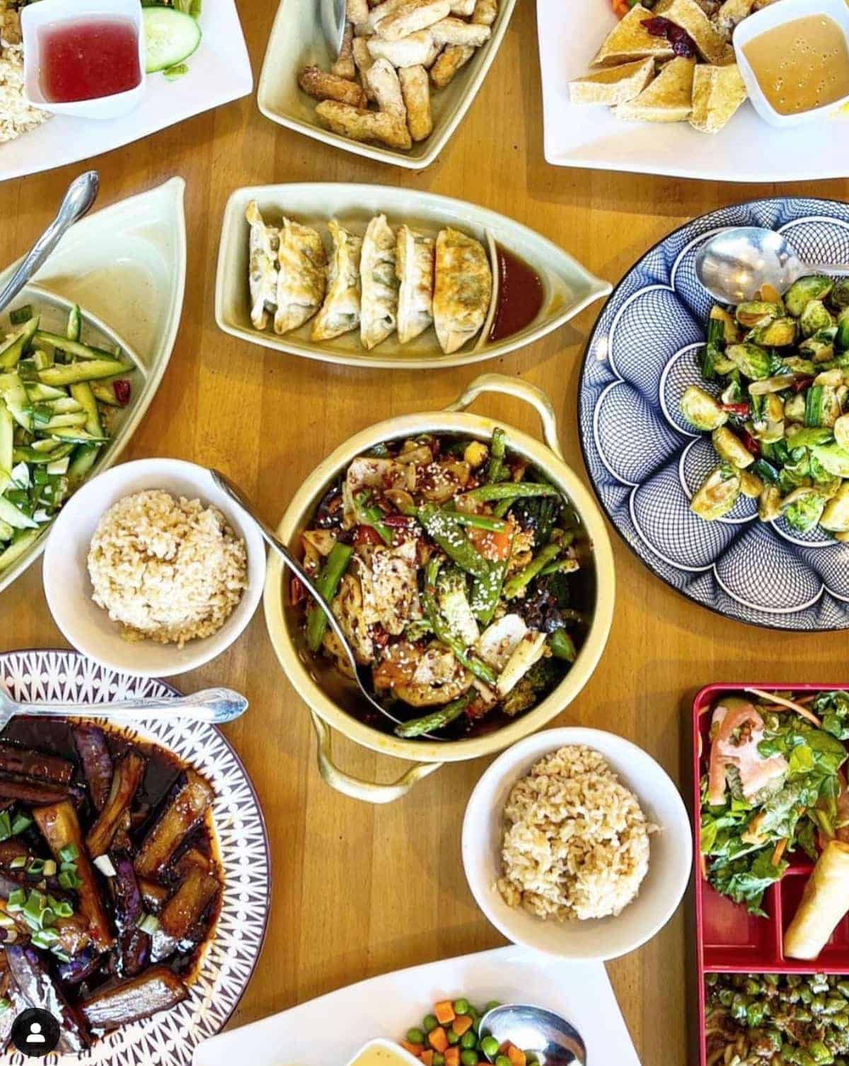 A table full of vegan Pan-Asian food.