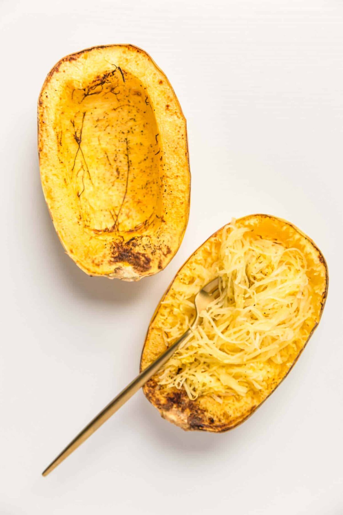 Spaghetti squash fluffed with a fork.