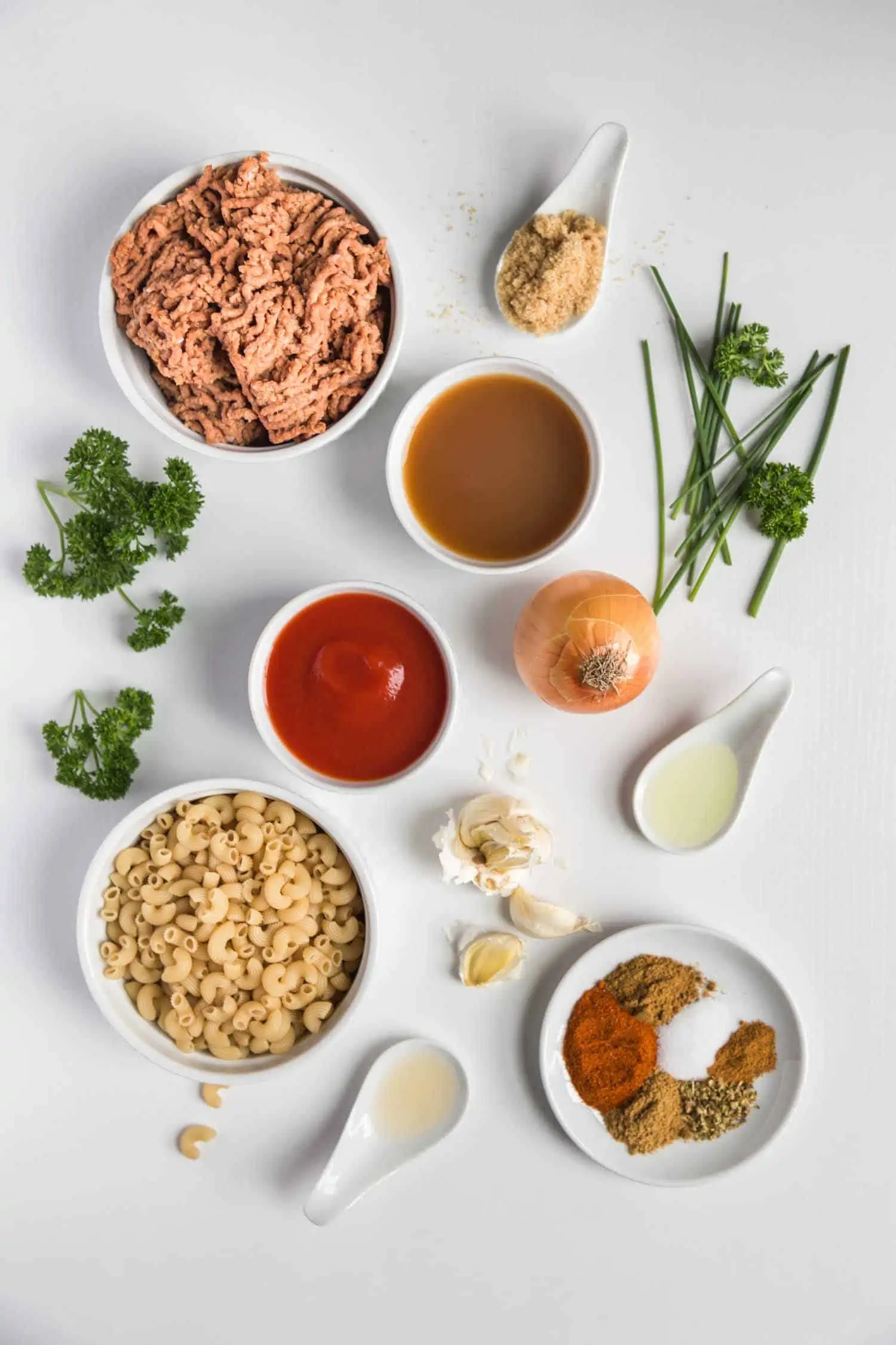 plant based hamburger helper ingredients flatlay with pasta, vegan meat, and spices