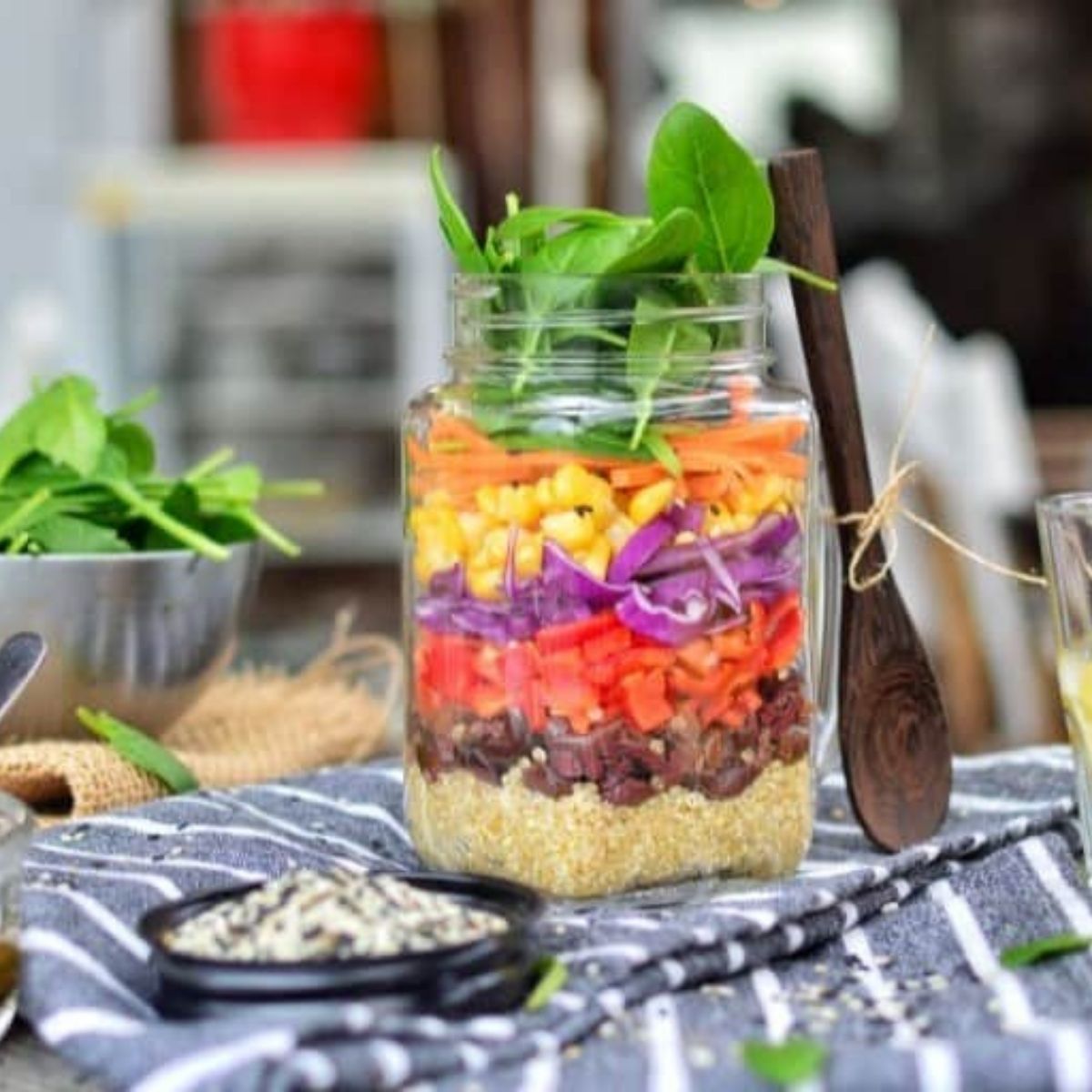 A layered rainbow salad in a jar.