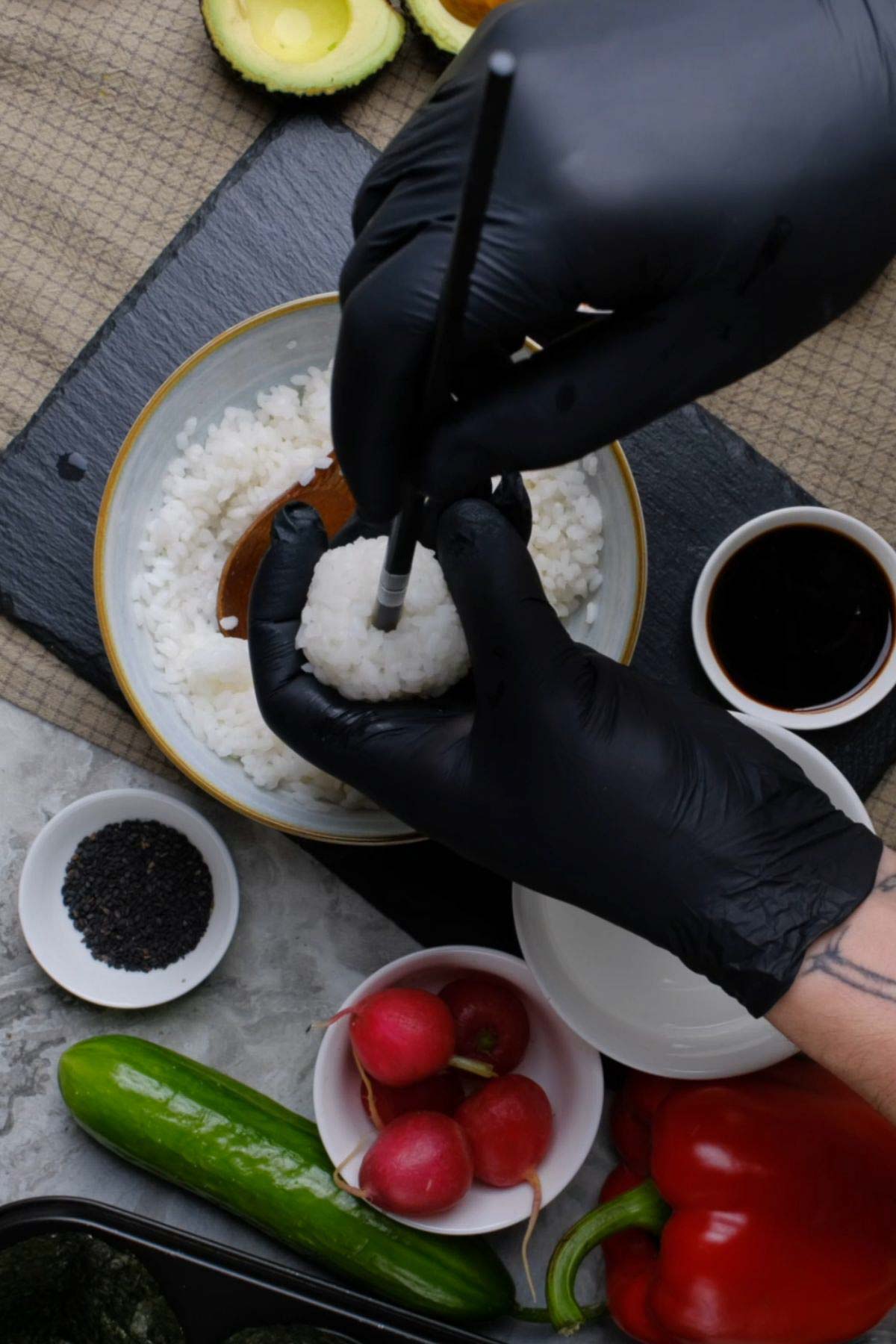 A ball of rice with a chopstick inserted in the middle.