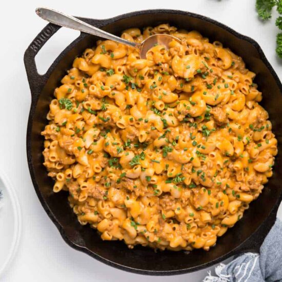 vegan hamburger helper recipe cooked in a skillet garnished with parsley
