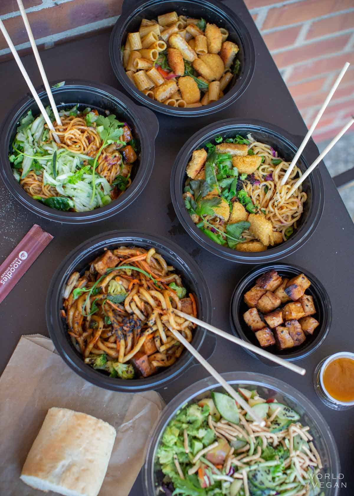 Bowls of vegan noodle and tofu options at Noodles and company