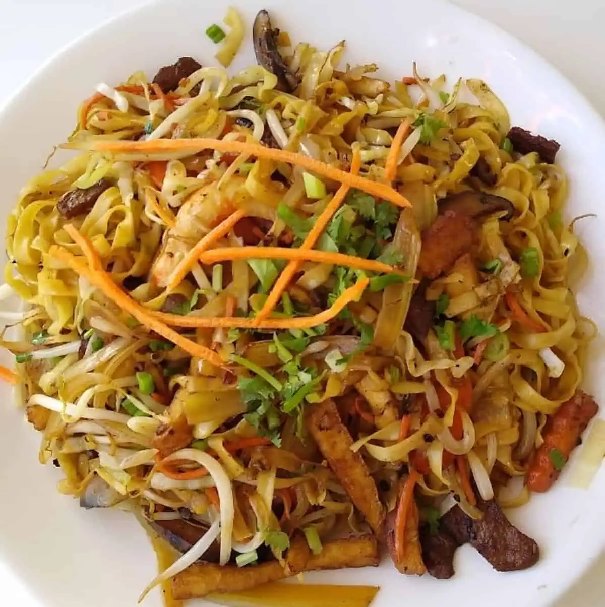 A yellow noodle stir fry from Loving Hut in Orlando.