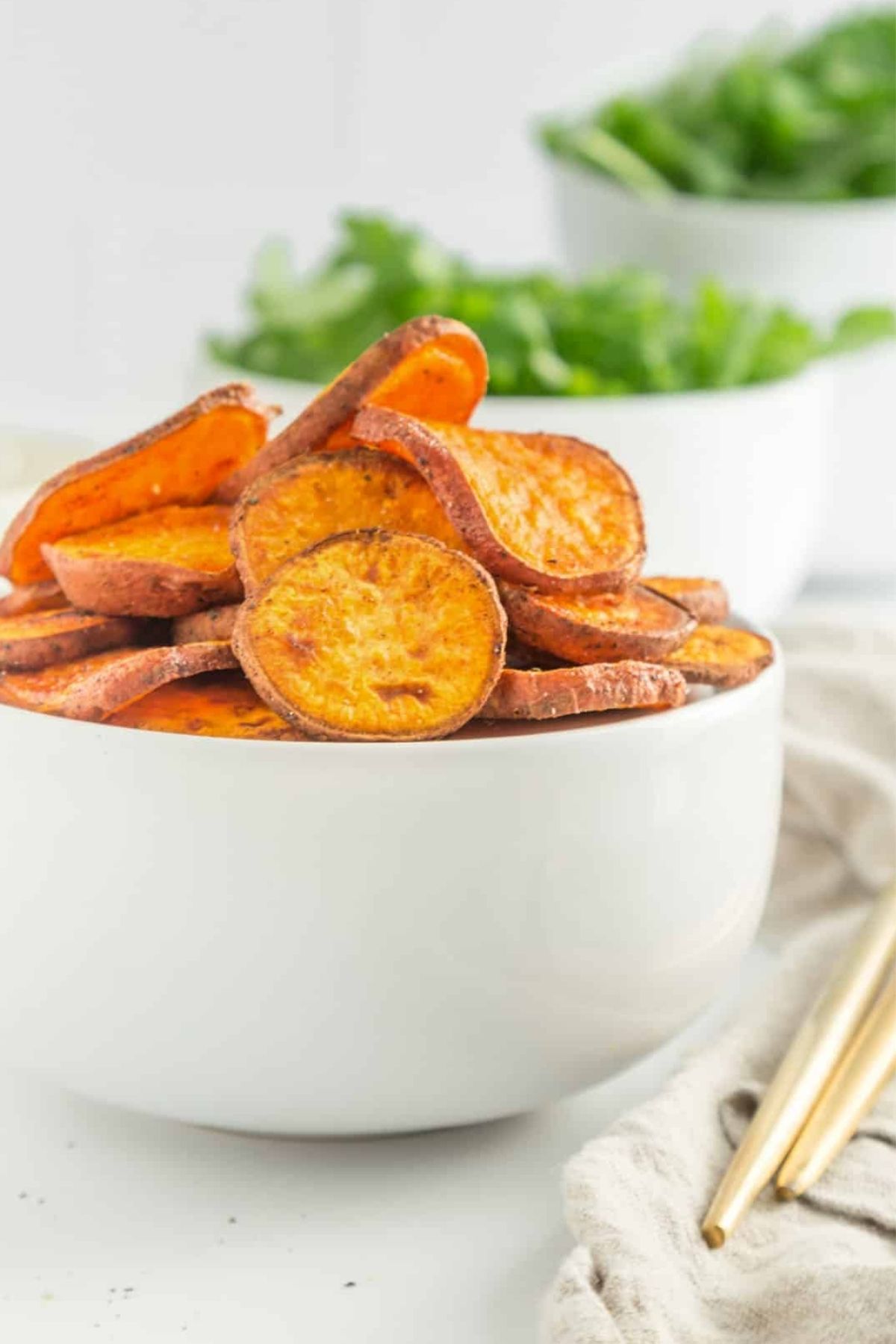 A bowl of crispy sweet potato slices.