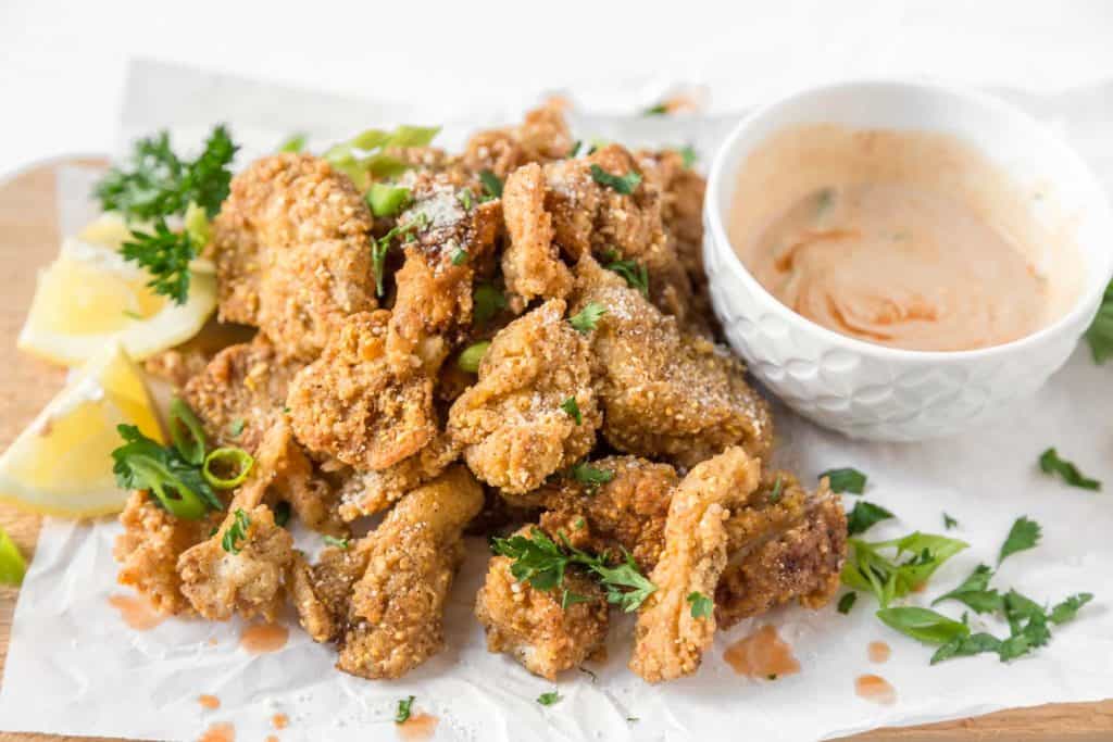 crispy fried oyster mushrooms vegan recipe served with spicy dairy free dipping sauce