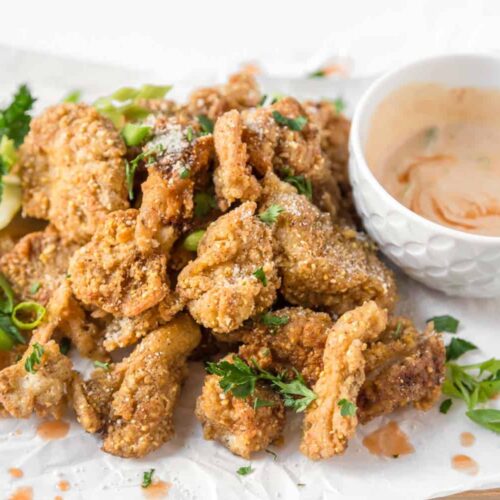 crispy fried oyster mushrooms vegan recipe served with spicy dairy free dipping sauce