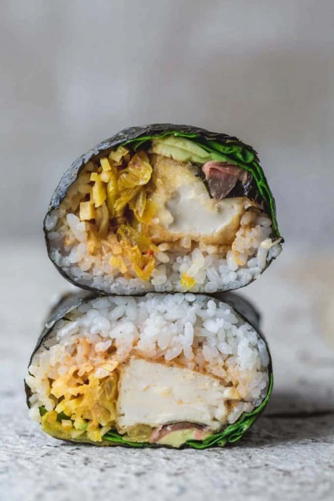 vegan sushi wrap with crispy tofu, lettuce, kimchi, vegan chipotle mayo, and more