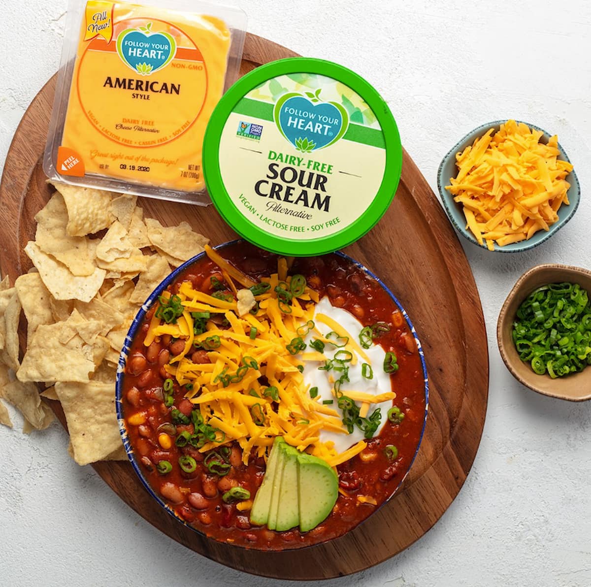 Follow Your Heart dairy-free sour cream next to a follow of vegan chili.