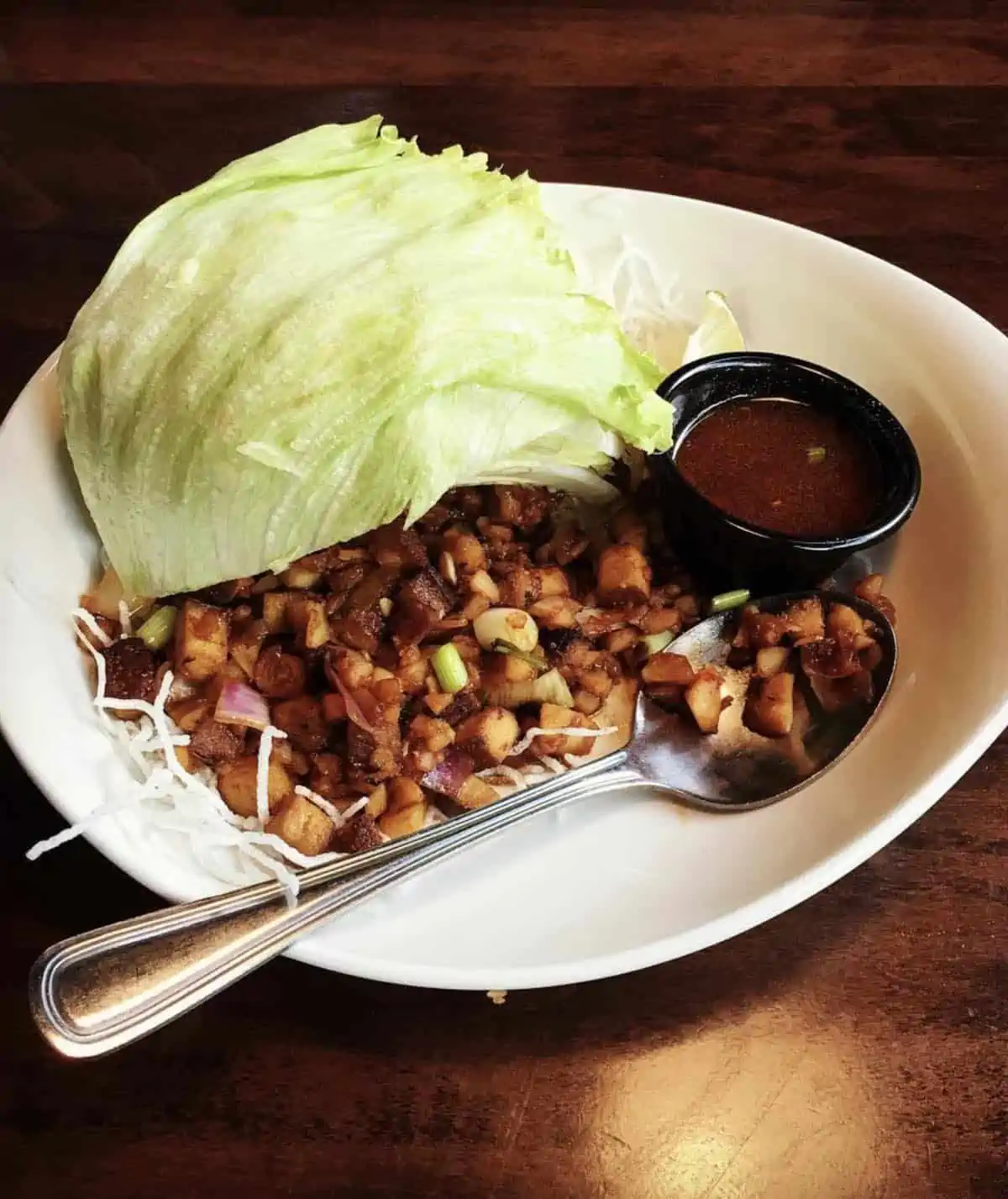 The vegan lettuce wraps served on a plate at PF Changs.