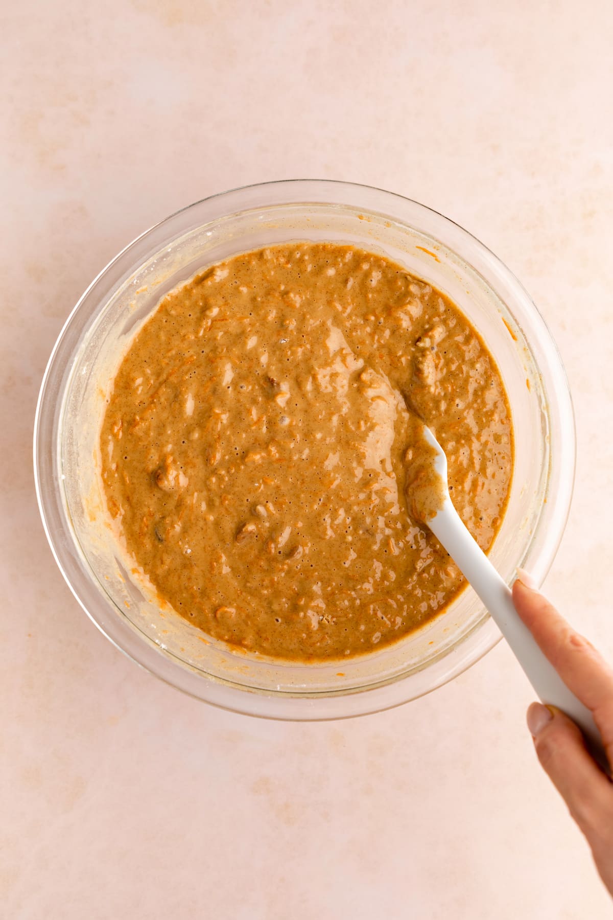 A bowl of vegan carrot cake batter.