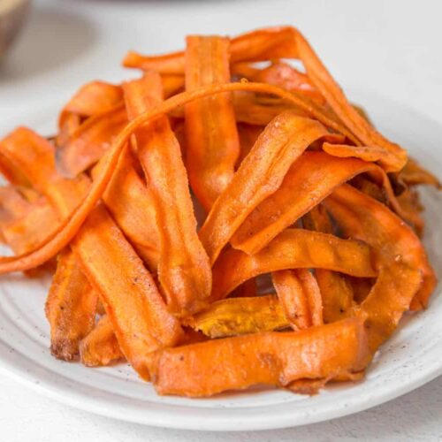 carrot bacon strips served on a plate