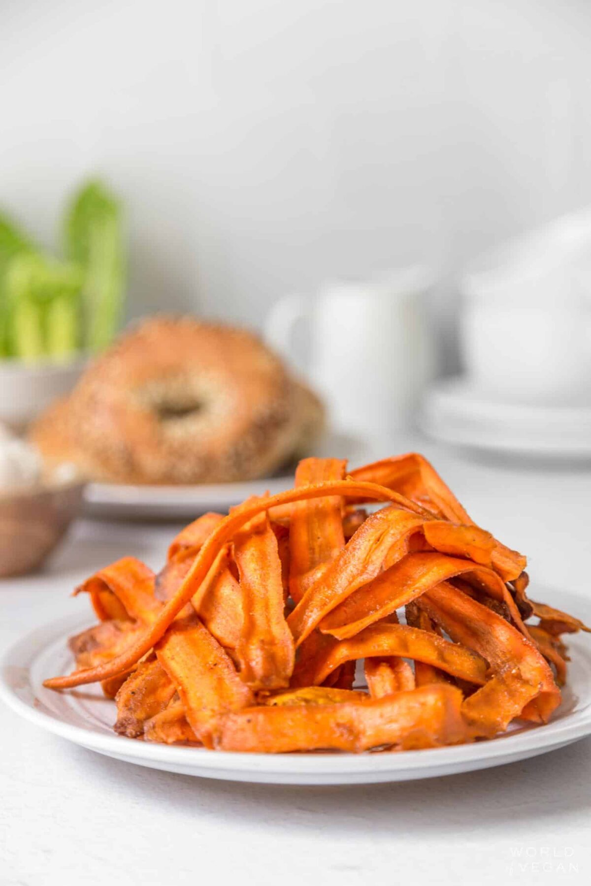 A plate of crispy veggie bacon made from carrots.
