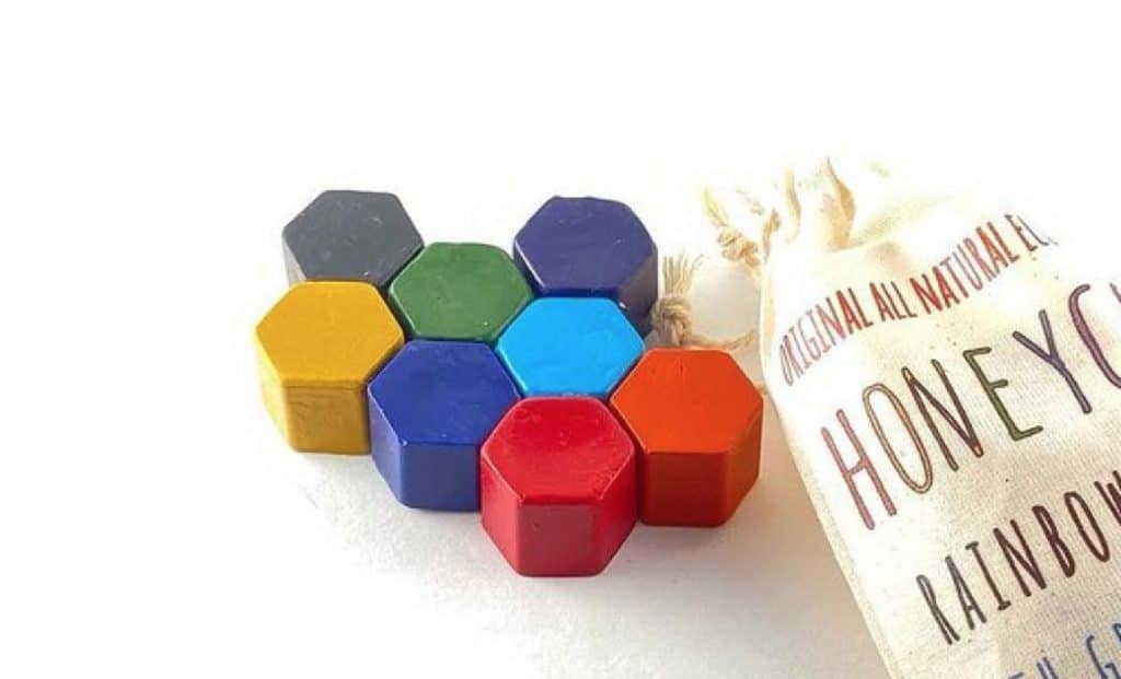 A set of 8 colorful hexagon soy wax crayons.