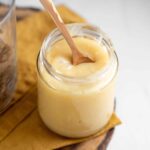 jar or vegan condensed milk made from coconut with a spoon