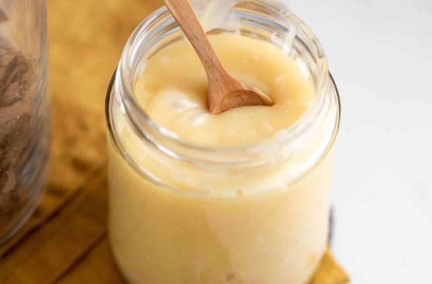 jar or vegan condensed milk made from coconut with a spoon